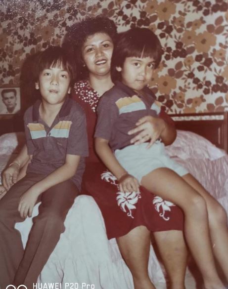 Nick Mikhail with his mother and sibling