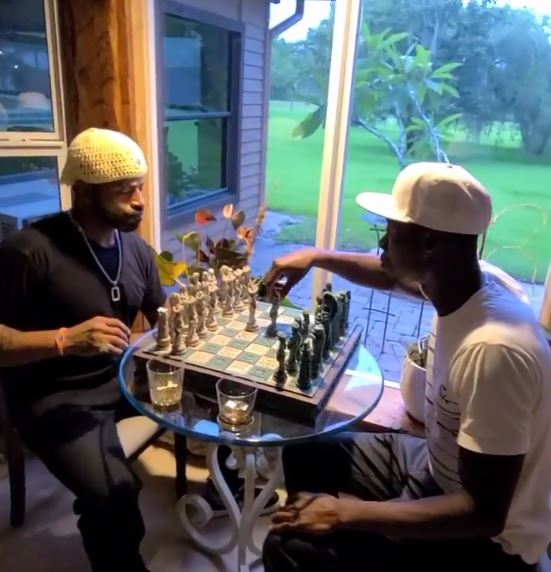 Polight playing chess with his brother