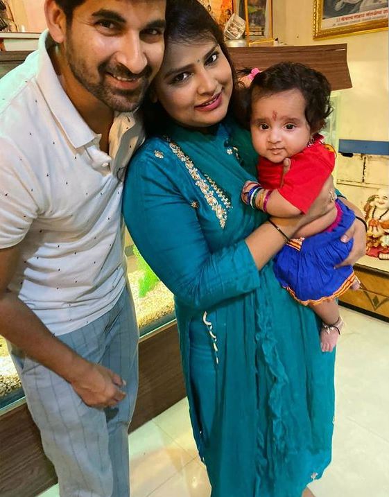 Akshay Waghmare with his wife and daughter