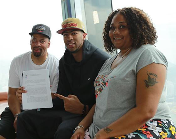 Anthony Davis with his father and mother