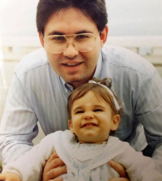 Childhood photo of Alicia Sanz with her father