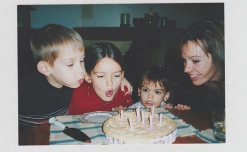 Childhood photo of Emma Mackey with her mother and siblings