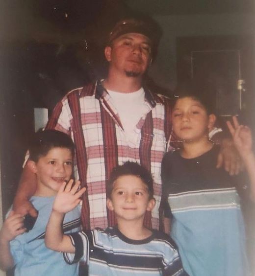Childhood photo of Ondreaz Lopez with his father and brothers Tony Lopez and Xavier Lopez