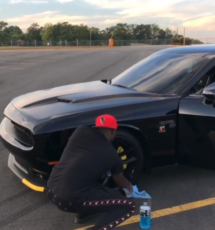 Desi Banks washing his new Challenger for a video