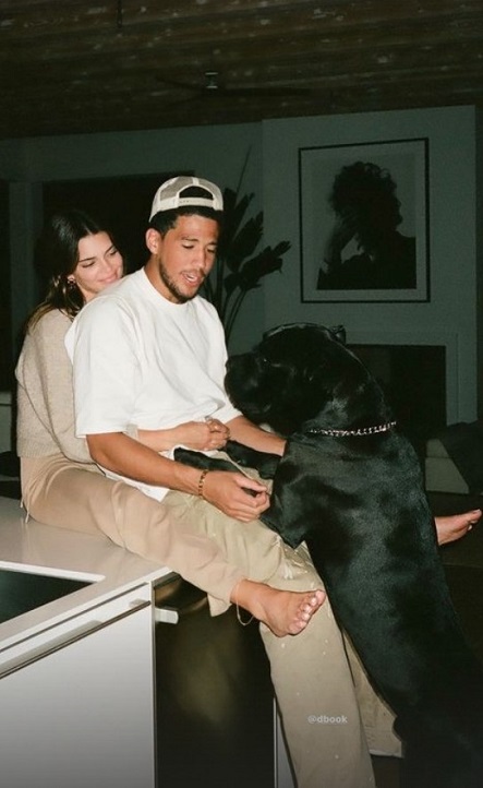 Devin Booker at his girlfriend Kendall Jenner's playing with her dog