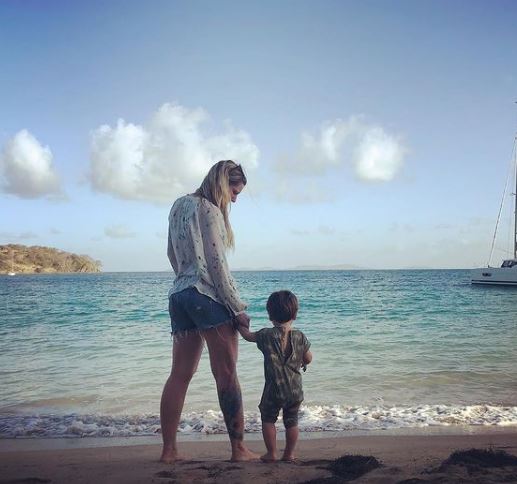 Elvira Lind at beach with her son