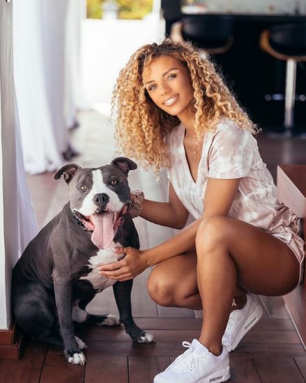 Frumes with her pet dog