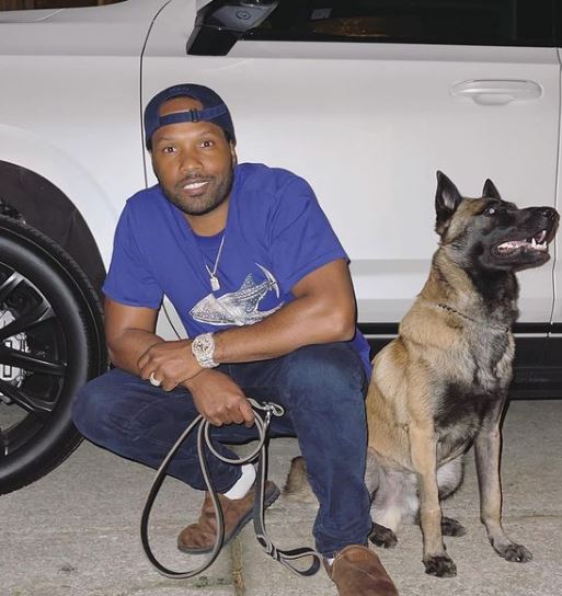 Mendeecees Harris with his pet dog