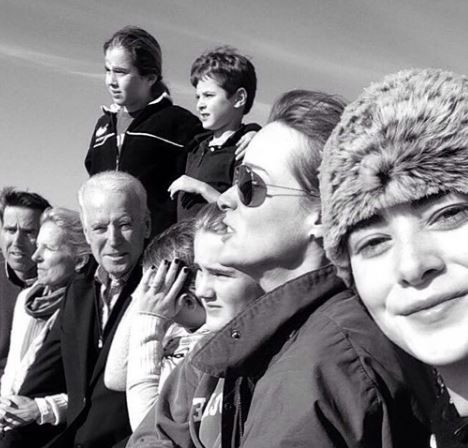 Naomi taking selfie with family
