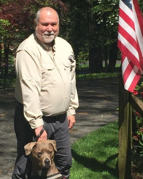 Robert David Steele with his pet dog