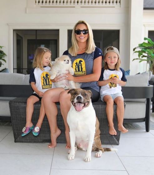 Brittany with her kids and pet dogs