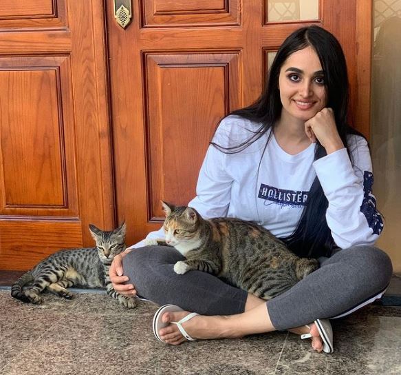 Lana Rose with her pet cats Daisy and Mowgli