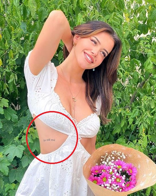Lea Elui Ginet has a tattoo on her waist