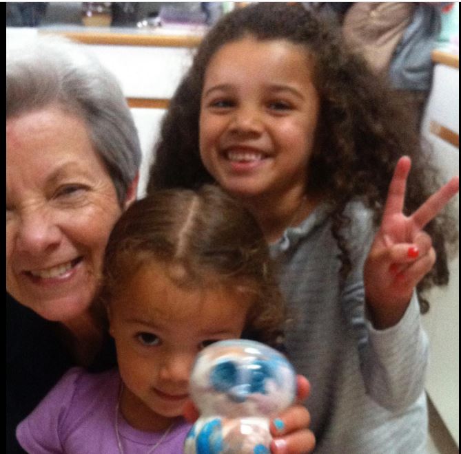 Malia baker childhood picture with her grandmother and sister