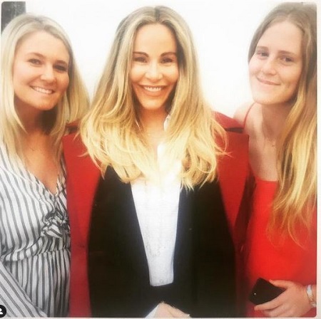 Raine Finley with her mother and sister at party event