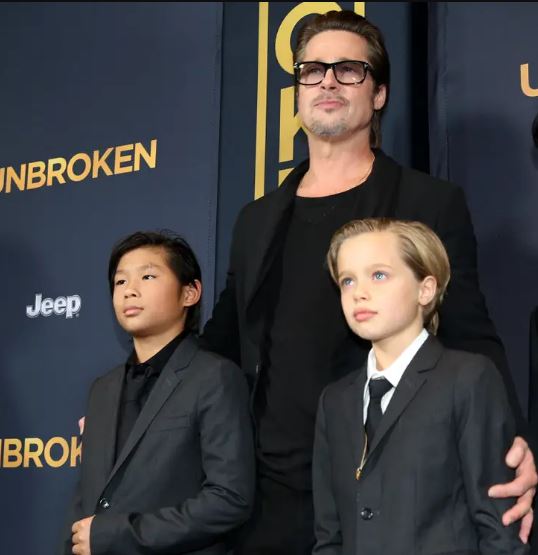 Shiloh Jolie-Pitt with her father Brad Pitt