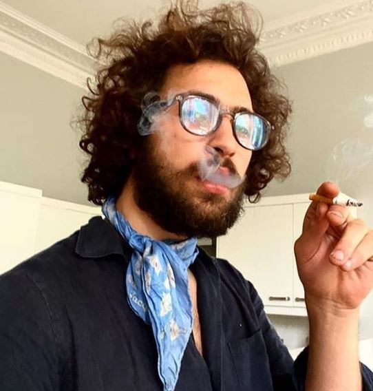 Barney Harris often smokes cigarette