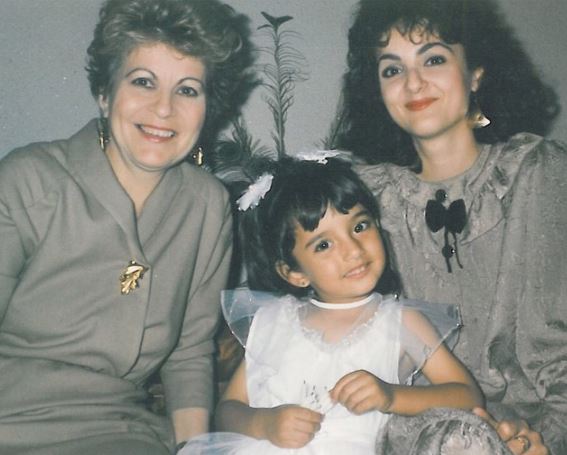 Childhood photo of Amina with her mother and grandmother
