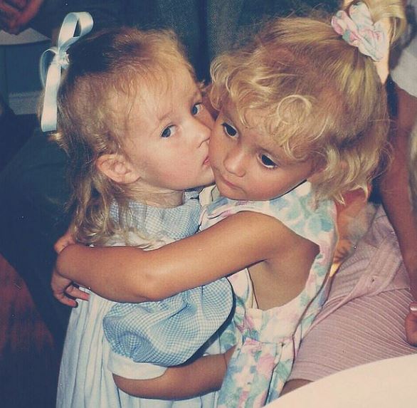 Childhood photo of Lauren with her sibling
