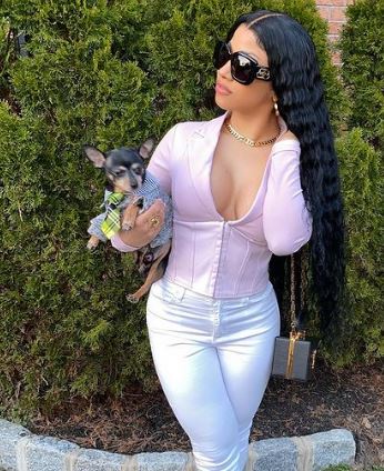 Hennessy Carolina and her pet dog