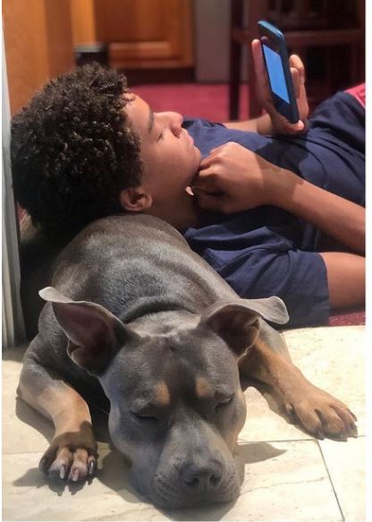Jaden Michael with his pet dog Kona
