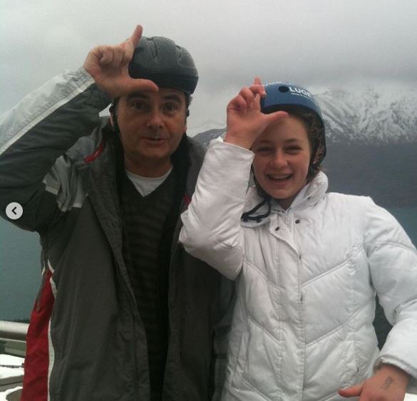 Lucy Currey old image with her dad