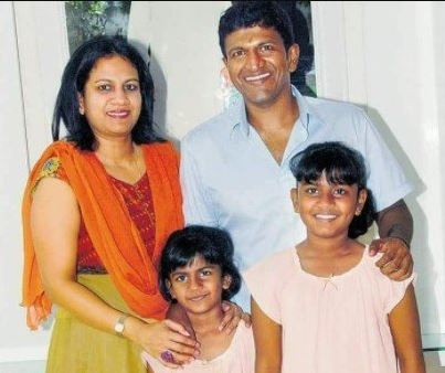 Puneeth Rajkumar with his wife and daughters
