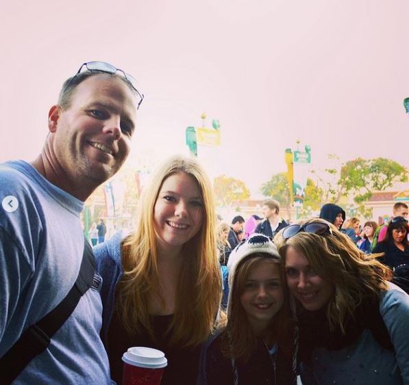 Shawn Hochuli with his spouse and daughters