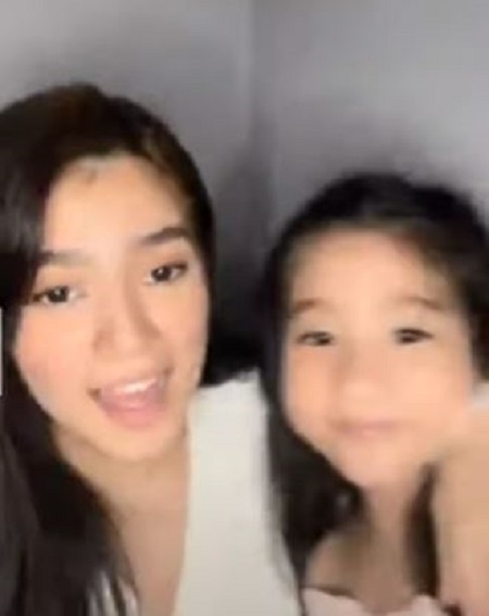 Belle Mariano with her sister