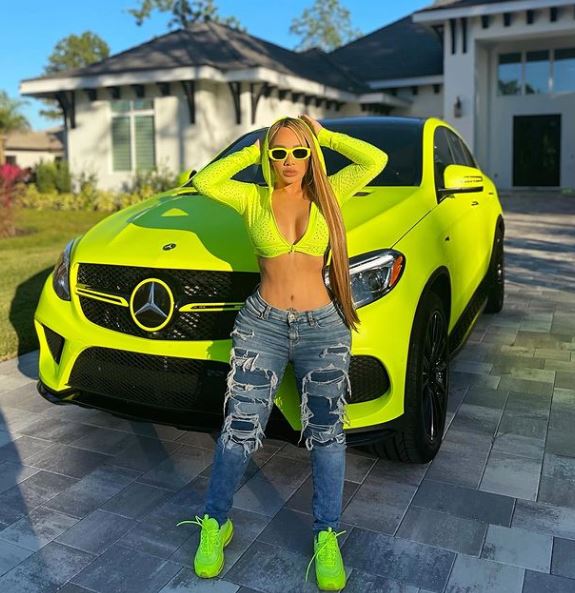 Debbie Von Marie Jimenez Garcia with her car