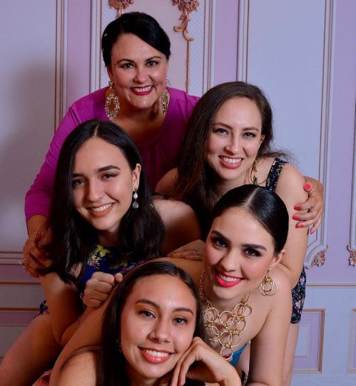 Debora Hallal with her mom and sisters
