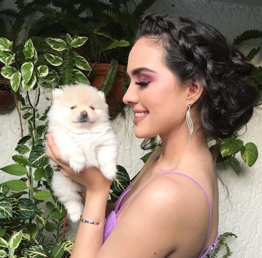 Debora Hallal with her pet dog Moppy