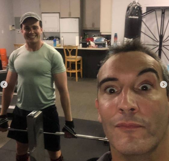 Joshua with his gym coach