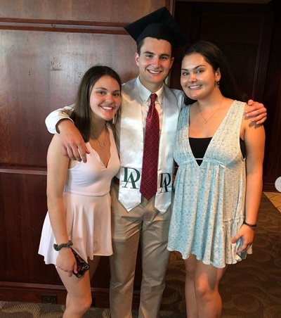 Michael Savarino with his sisters