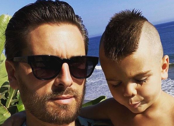 Reign Disick with his father