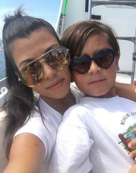Reign Disick with his mother