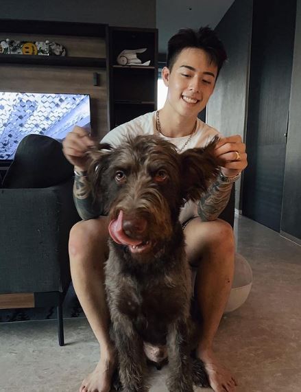 Titus Low with his pet dog