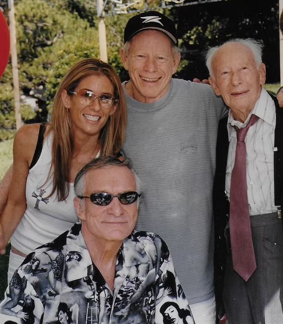 An old photo of Jennifer with her dad Dr Mark Saginor and Hugh Hefner