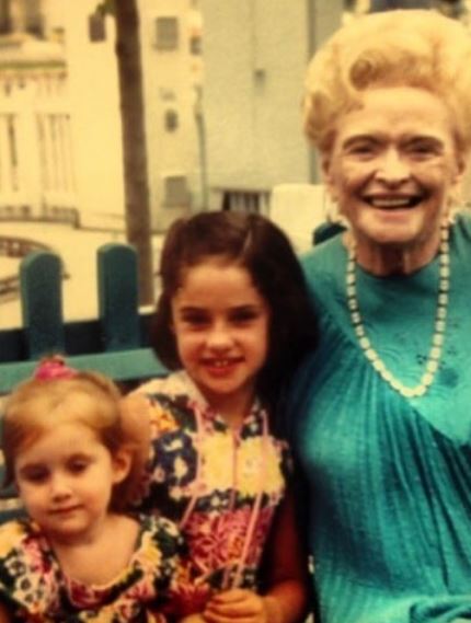 Childhood photo of Julianna with her grandmother and sister