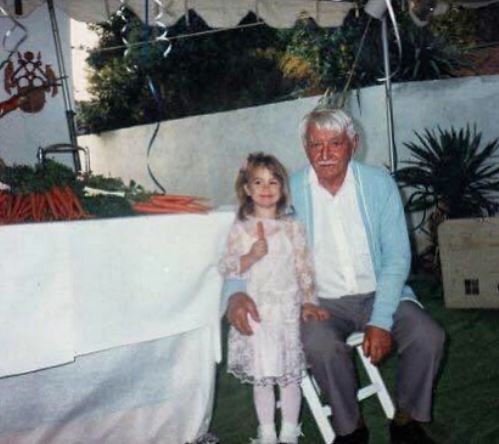 Childhood photo of Samantha with her grandfather