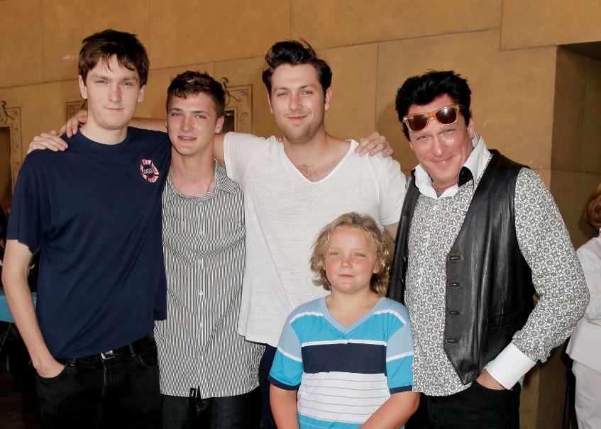 Hudson Madsen with his father and siblings