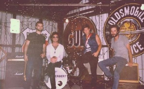 Josh Herbert with his band group
