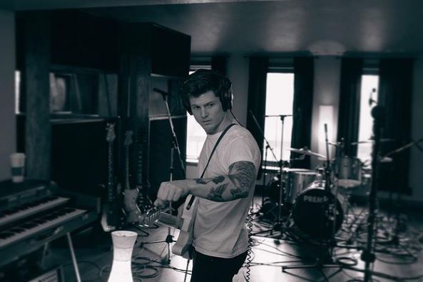 Josh in his music studio
