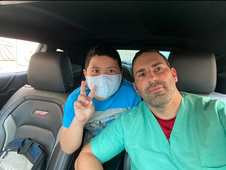 Leonardo Gil with his son