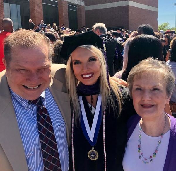 Abby Broyles with her parents