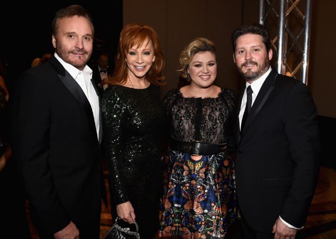 Brandon with his dad Narvel Blackstock, mom Reba McEntire, and ex-partner Kelly Clarkson
