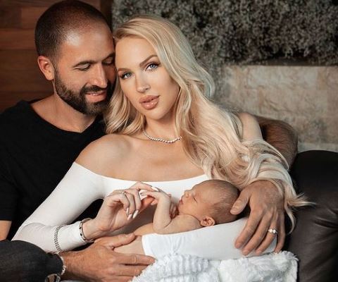 Christian Richard with his wife and child