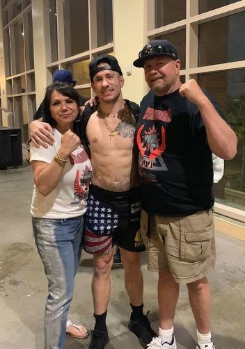 Jesse Strader with his father and mother