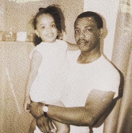 Kim Godwin in her childhood with her father