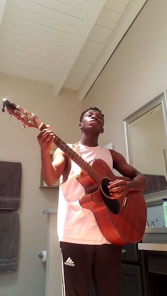 Olly Sholotan loves to play Guitar